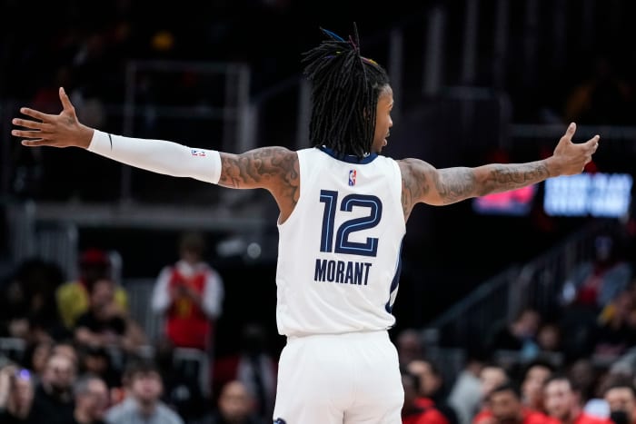 Memphis Grizzlies guard Ja Morant reacts after his team makes a shot.